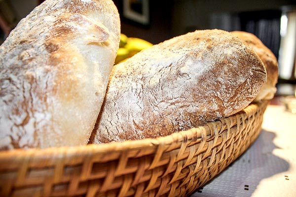 Ciabatta bread in a basket | BakingGlory.com